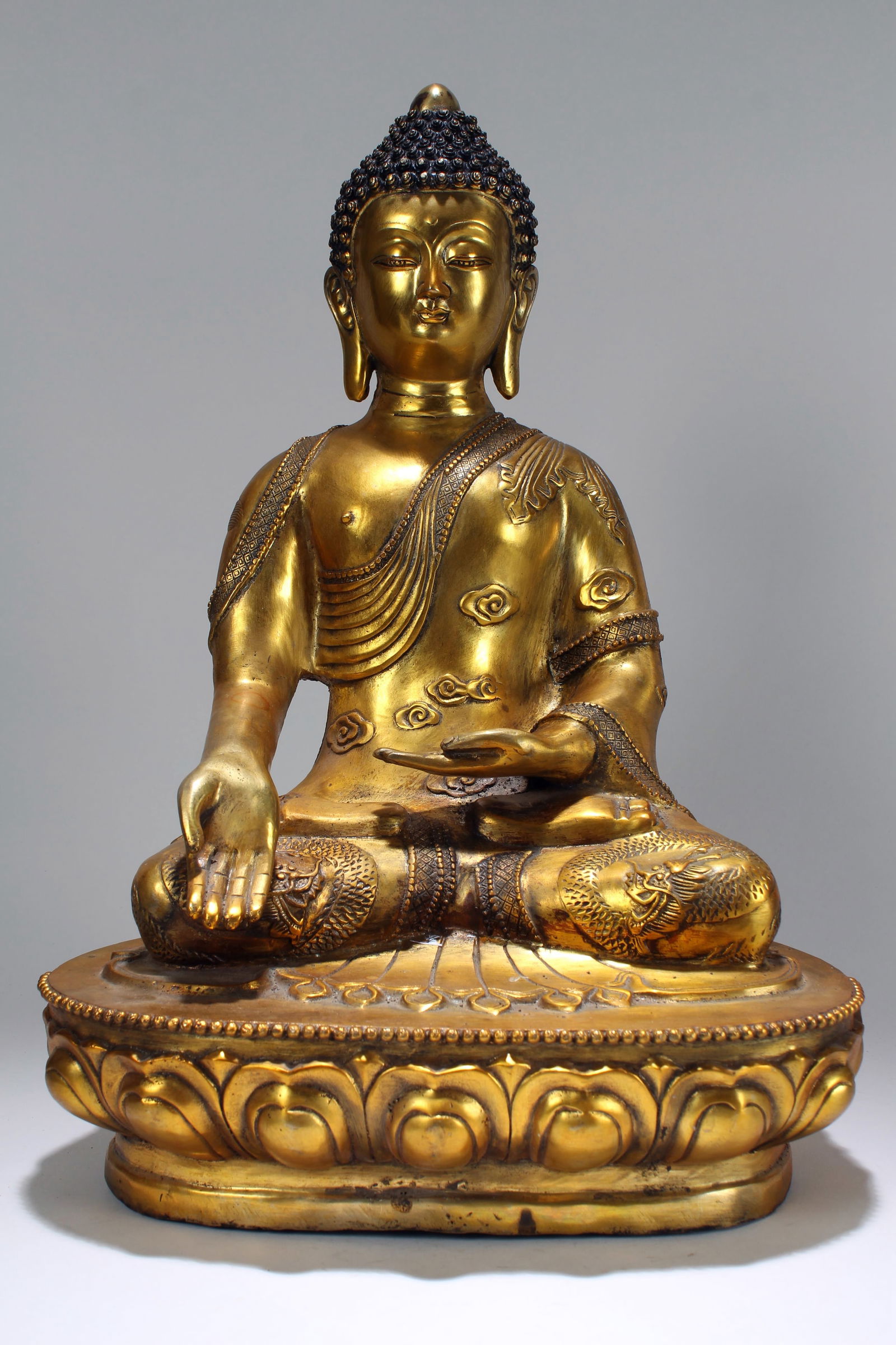 A CHINESE PONDERING-POSE  GILT