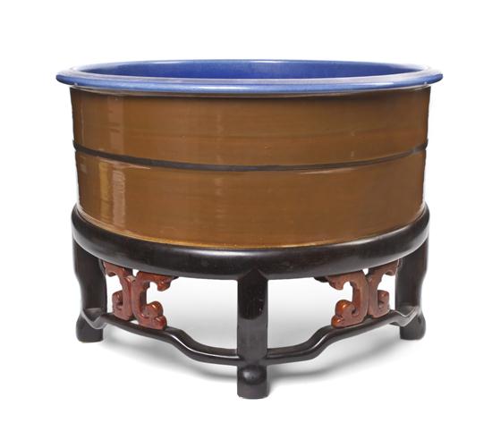 A Chinese Porcelain Fishbowl on a