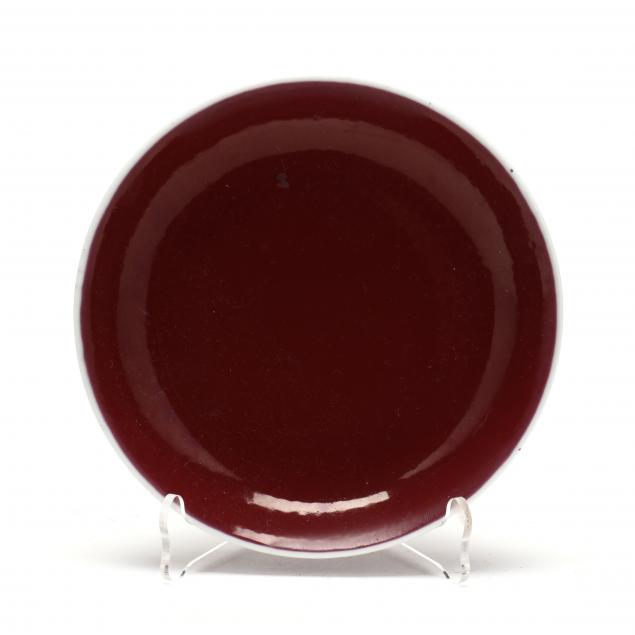 A CHINESE PORCELAIN OXBLOOD DISH 