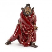 A Chinese pottery figure by Li