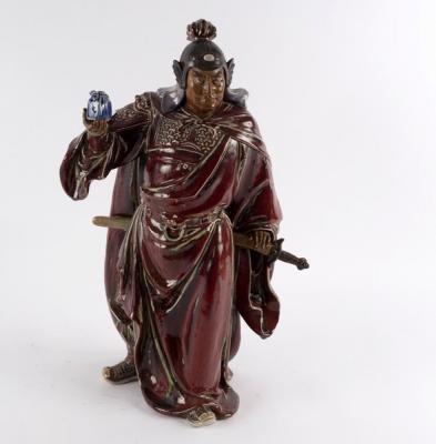 A Chinese pottery figure by Liu