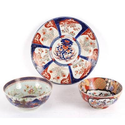 A Chinese punch bowl with clobbered
