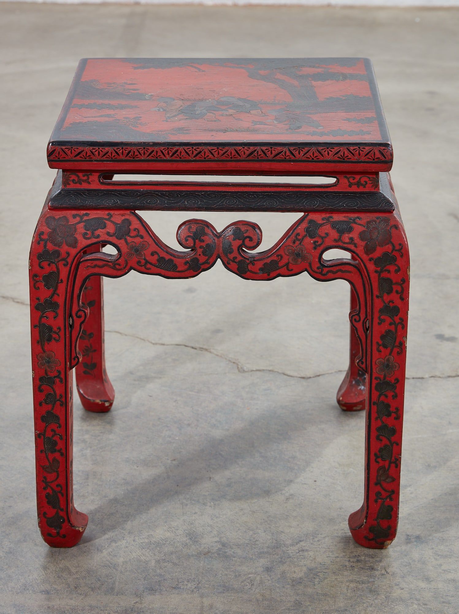A CHINESE RED AND BLACK PAINTED LOW
