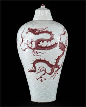 A CHINESE RED GLAZED DRAGON CO