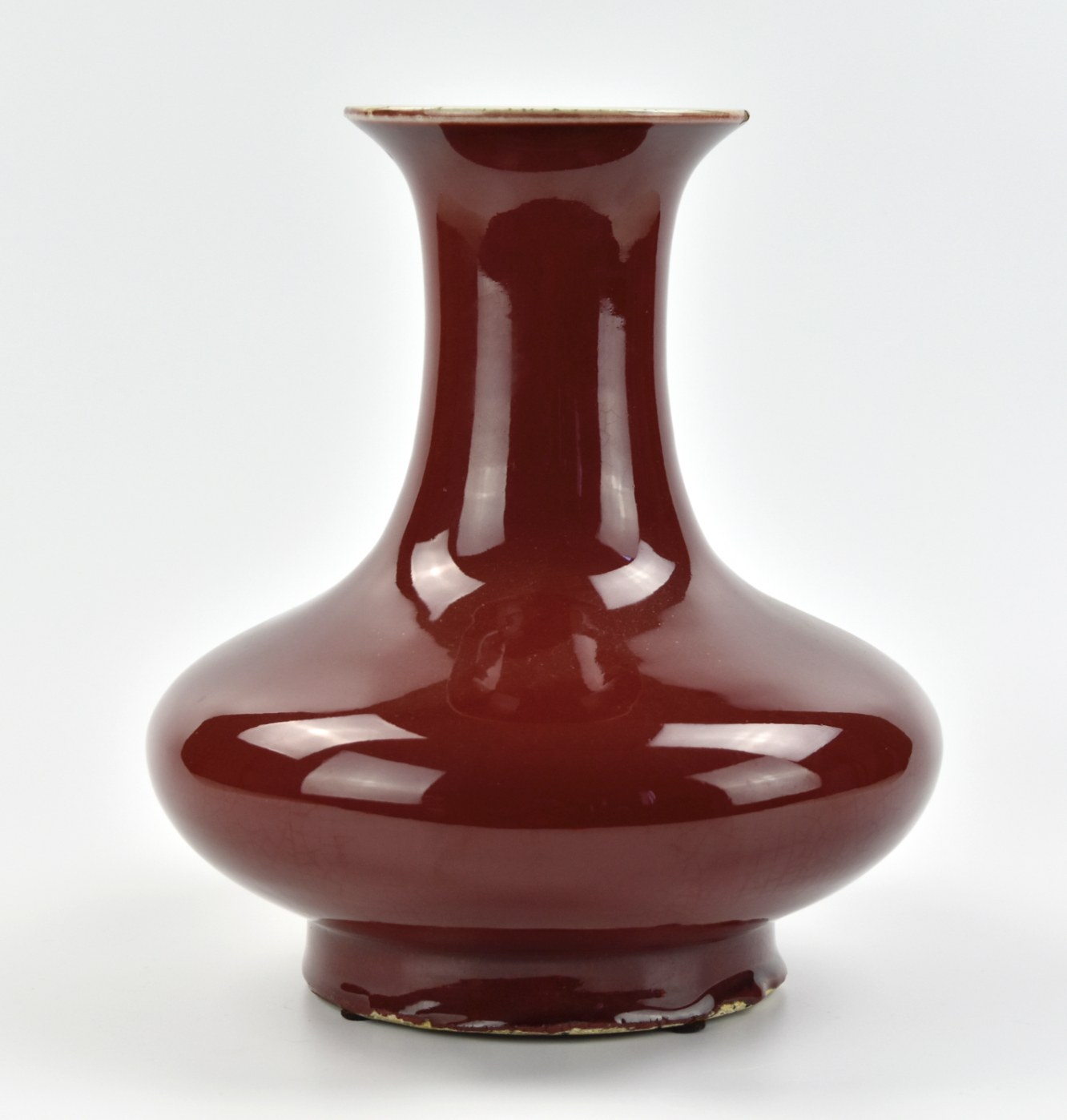 A CHINESE RED GLAZED VASE W/