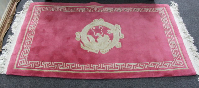 A Chinese rug sewn with dragon on