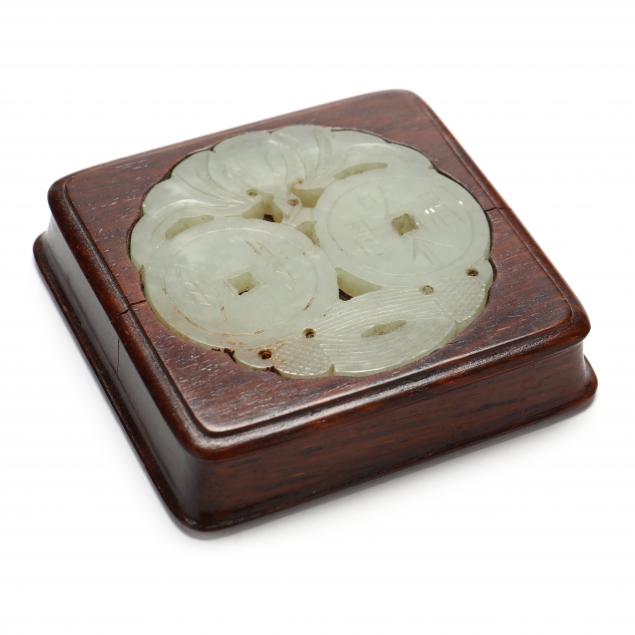 A CHINESE SERPENTINE MEDALLION IN