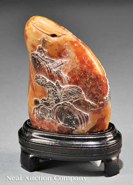 A Chinese Soapstone Pebble carved