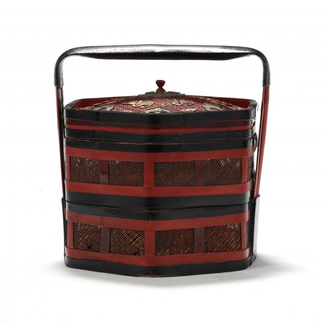 A CHINESE TIERED PAINTED AND GILDED
