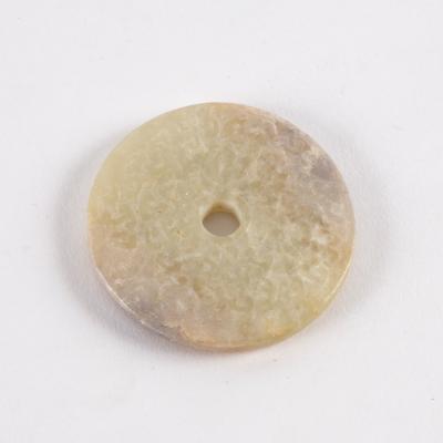A Chinese white jade bi-disc carved