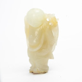 A CHINESE WHITE JADE FIGURE OF