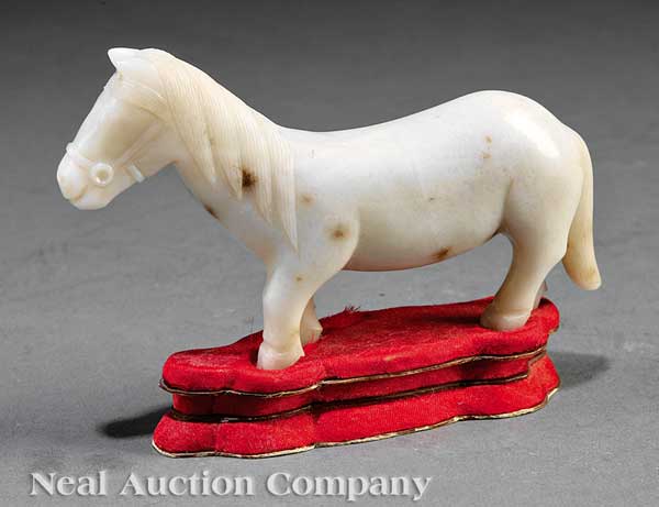 A Chinese White Jade or Onyx Figure
