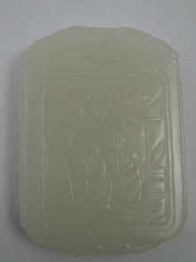 A Chinese white jade pendant with