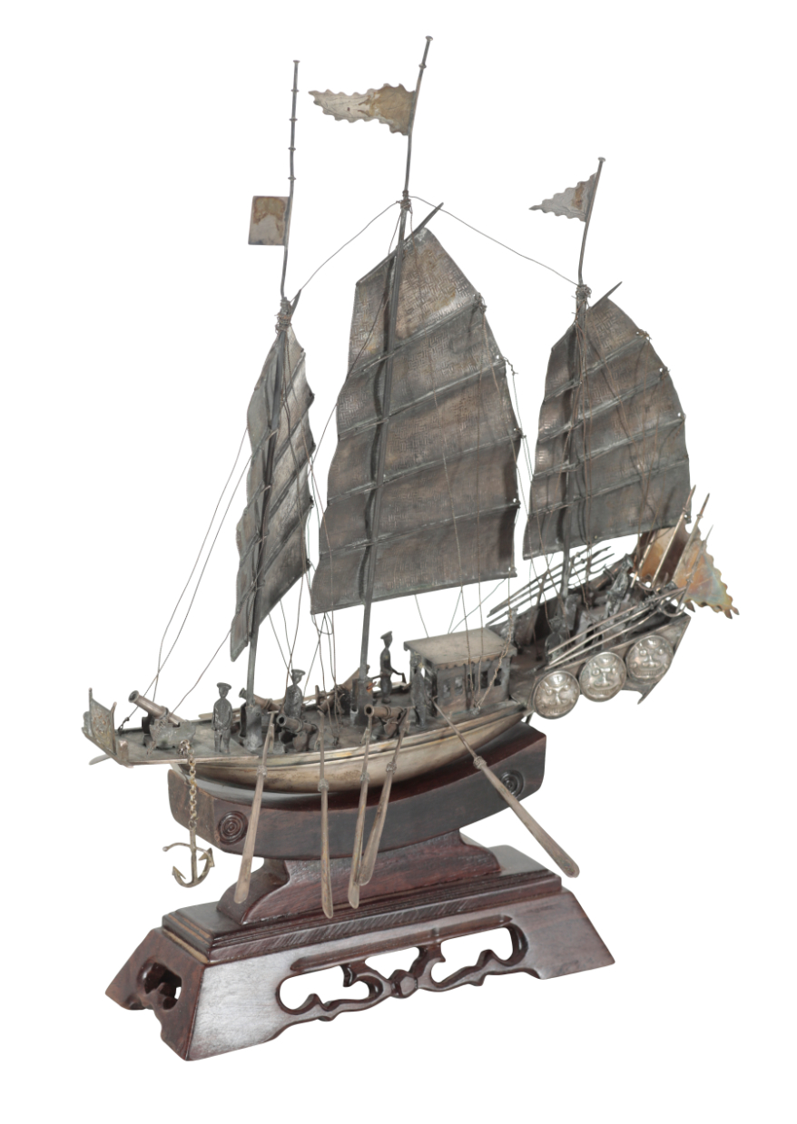 A CHINESE WHITE METAL MODEL OF A