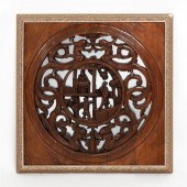 A CHINESE WOOD RELIEF MIRRORED
