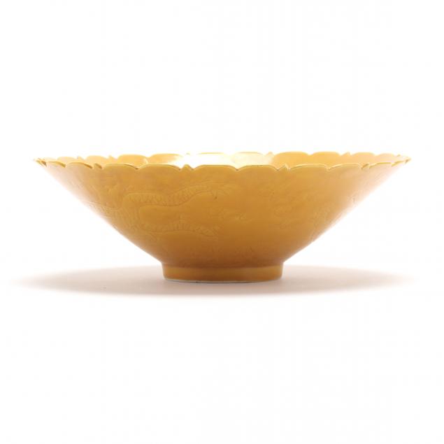 A CHINESE YELLOW GLAZED SGRAFFITO