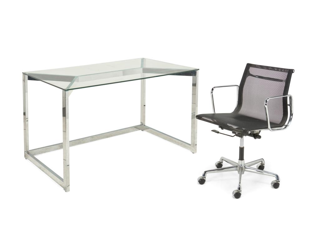 A CHROME AND GLASS DESK AND EAMES