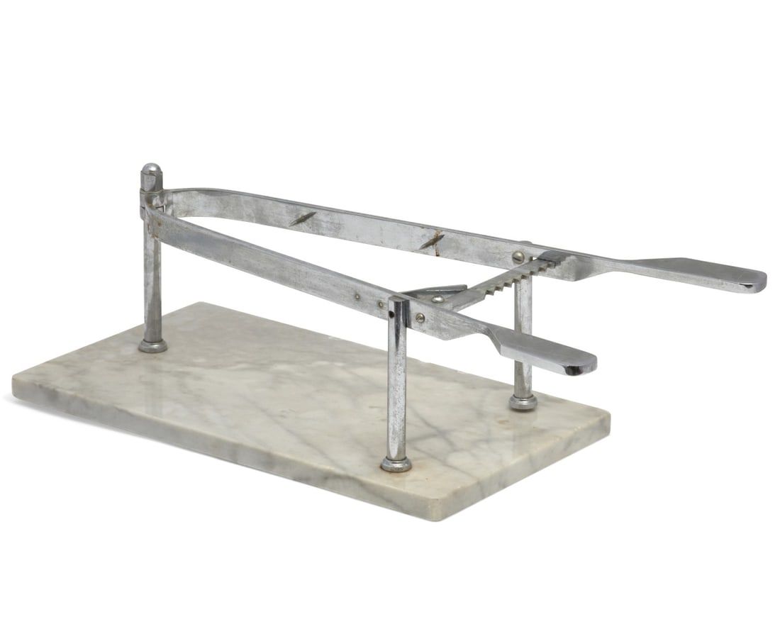 A CHROME AND MARBLE ROAST CARVING