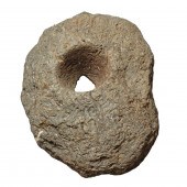 A CHUMASH METATE GRINDING STON