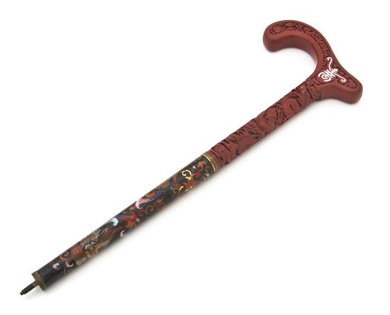 A Cinnabar and Enamel Walking Stick