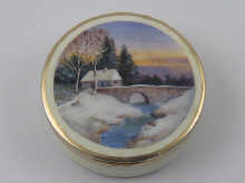 A circular box with a rural