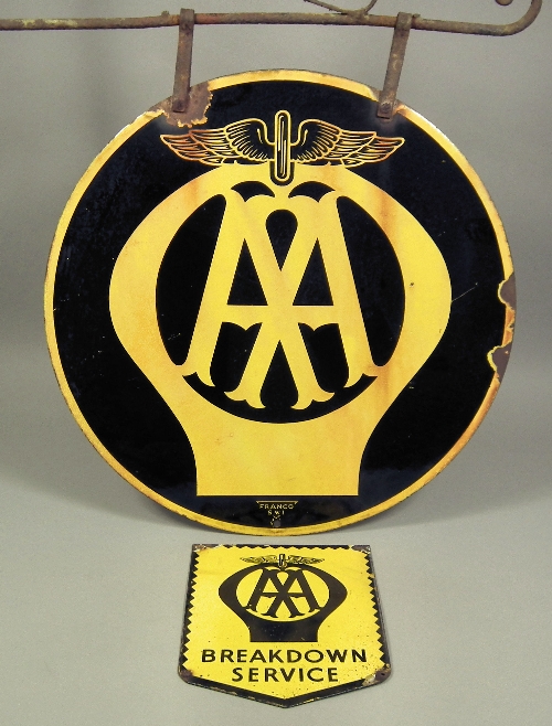A circular enamel AA sign with