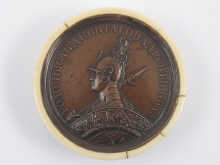 A circular ivory snuff box with