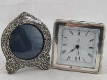 A circular silver photo frame