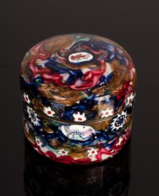 A circular snuff box, the metal