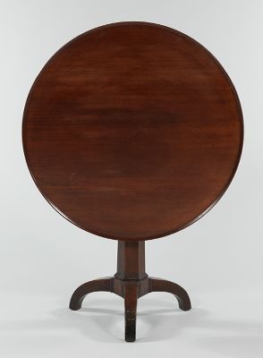A Circular Tilt Top Table