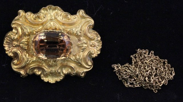 A citrine pendant/brooch the oval