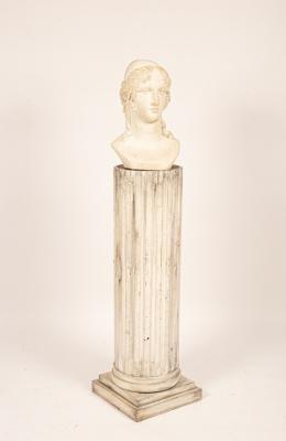 A Classical plaster bust on a