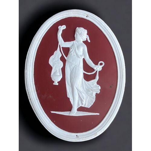 A CLASSICAL PLASTER WALL PLAQUE.