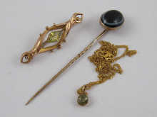 A claw set peridot pendant set in