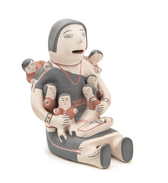 A Cochiti Storyteller having five
