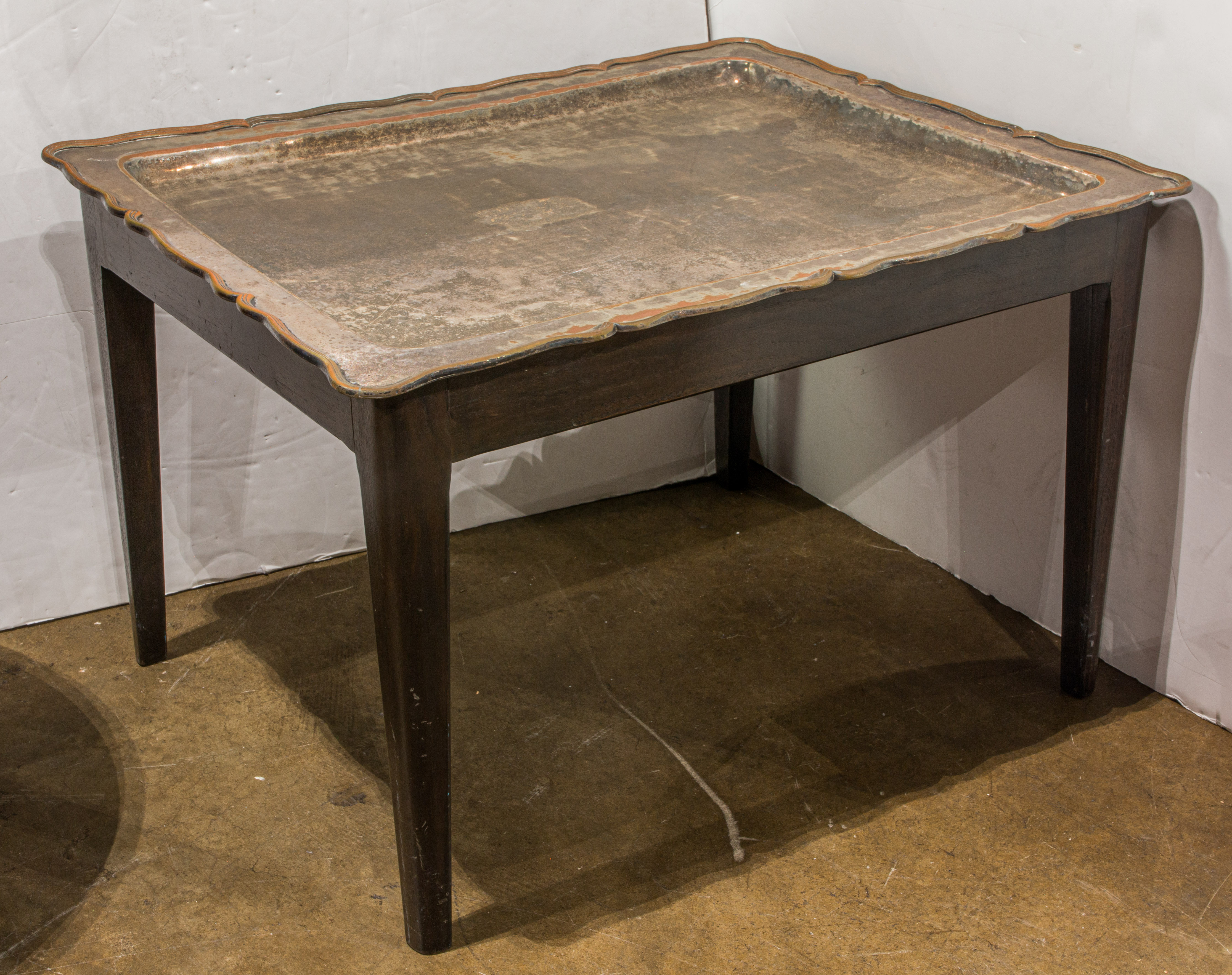 A COFFEE TABLE FASHIONED WITH A