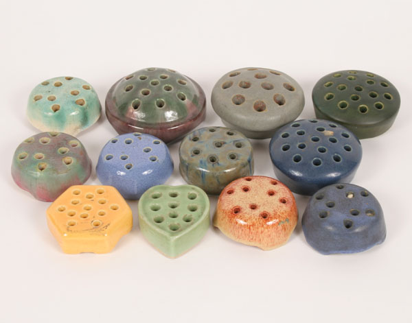 A collection of 12 art pottery
