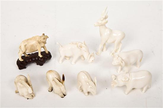 A Collection of Eight Carved
