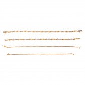 A COLLECTION OF FOUR 14K GOLD