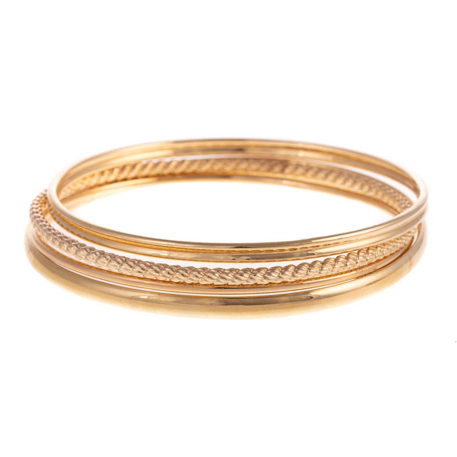 A COLLECTION OF FOUR BANGLES IN 14K