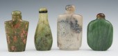 A Collection of Four Carved Ha