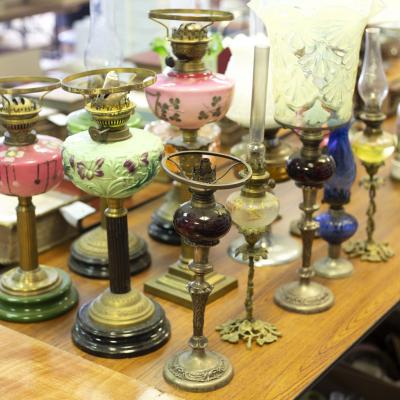 A collection of fourteen oil lamps,