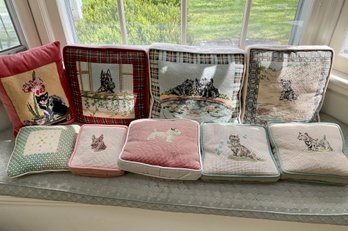 A collection of nine needlepoint