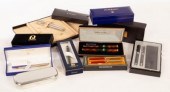 A collection of pens including