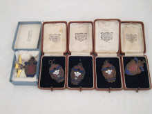A collection of six bronze & enamel