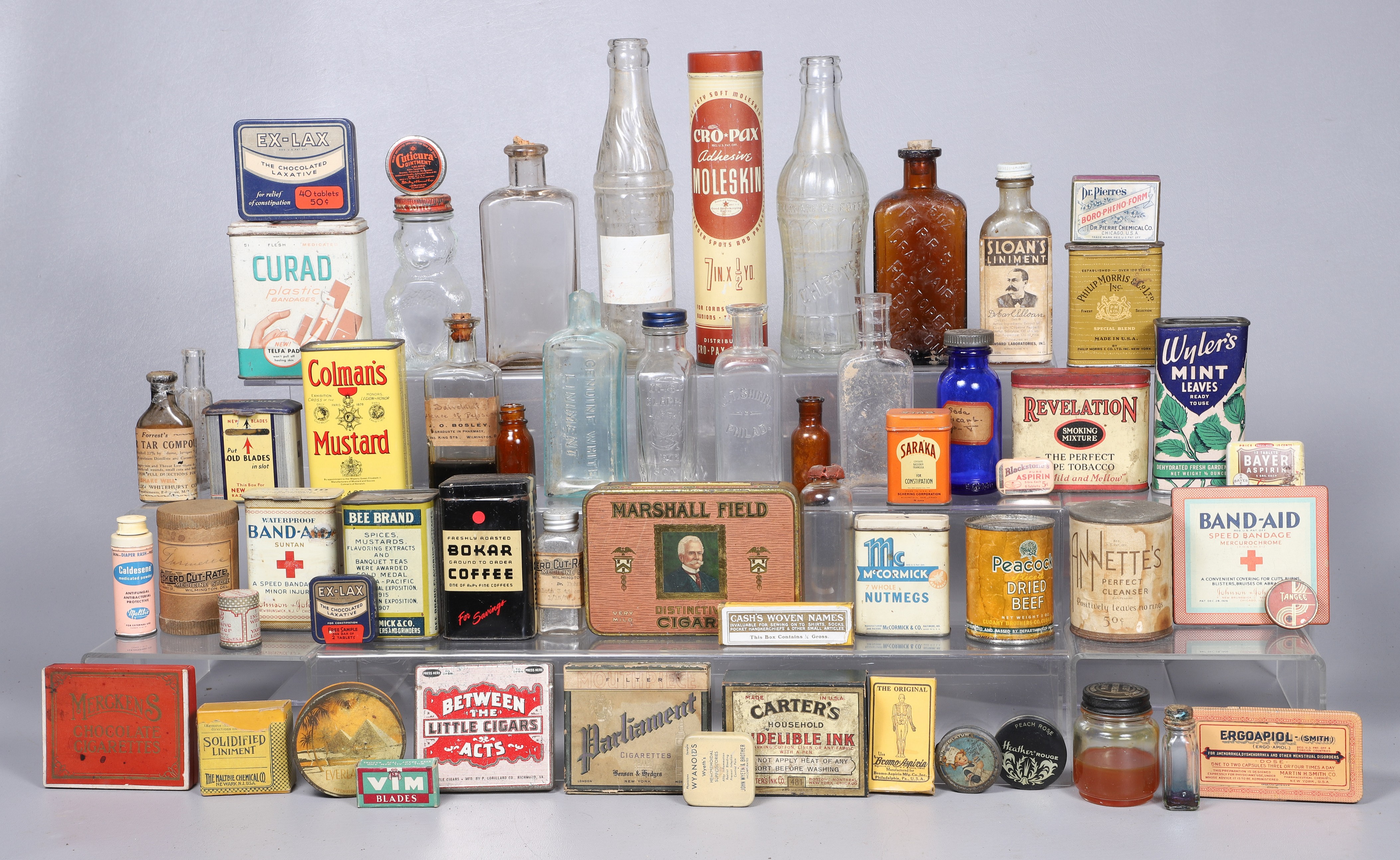 A Collection of tins and bottles,