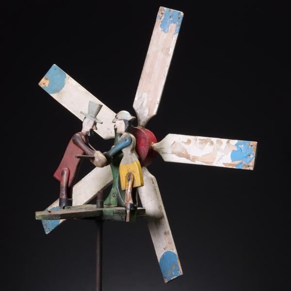 A COLORFUL CARVED AND PAINTED