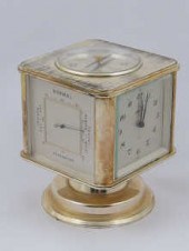 A combination clock/ barometer