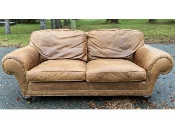 A contemporary brown leather two