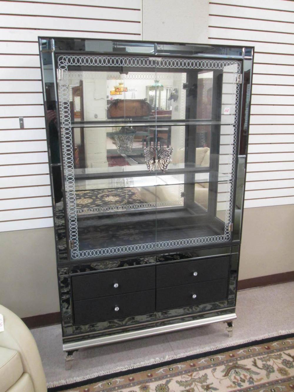 A CONTEMPORARY CURIO CABINET ON